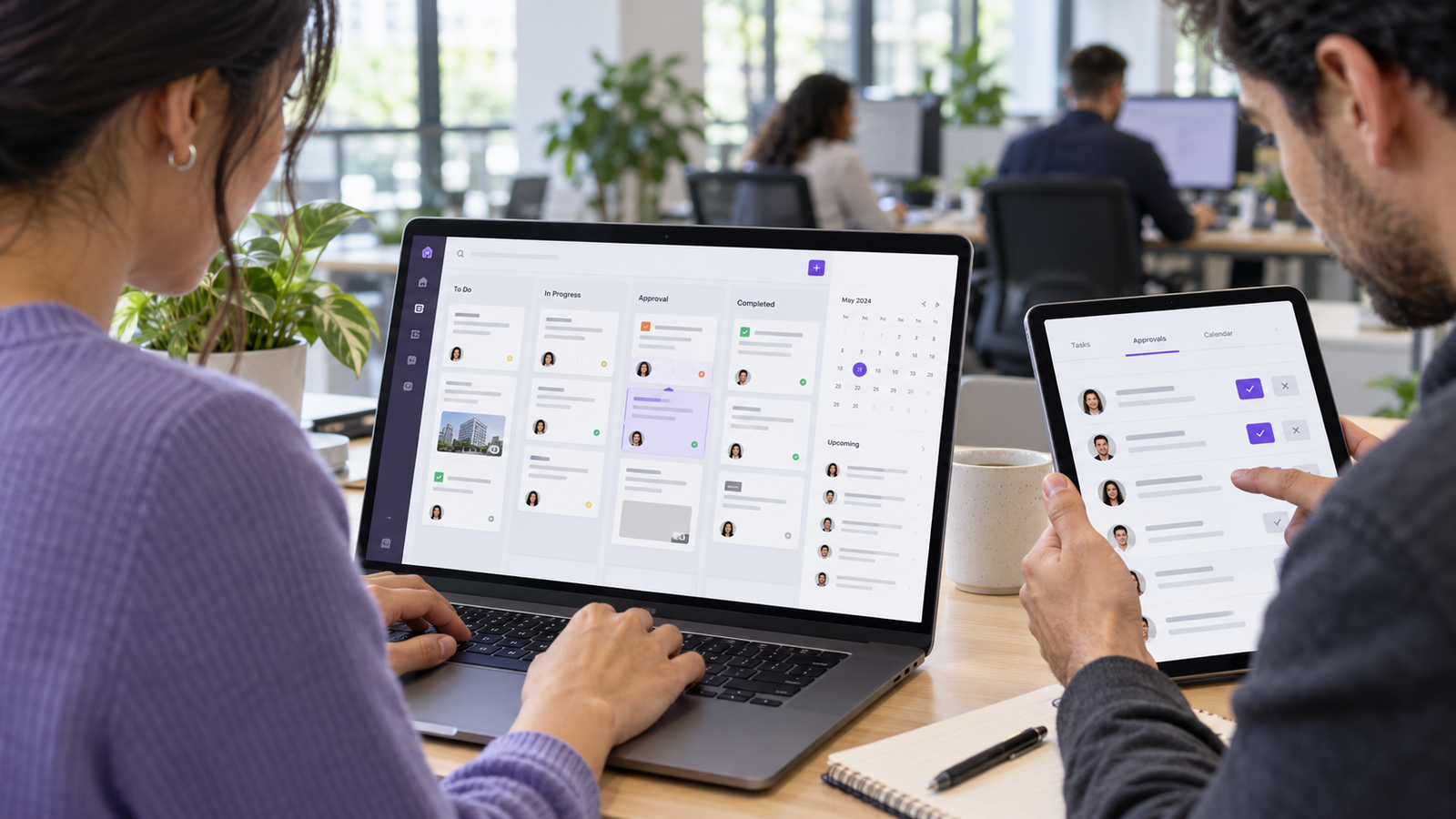App Development 39 Employees managing task assignments and approvals using a workflow app on a laptop and tablet